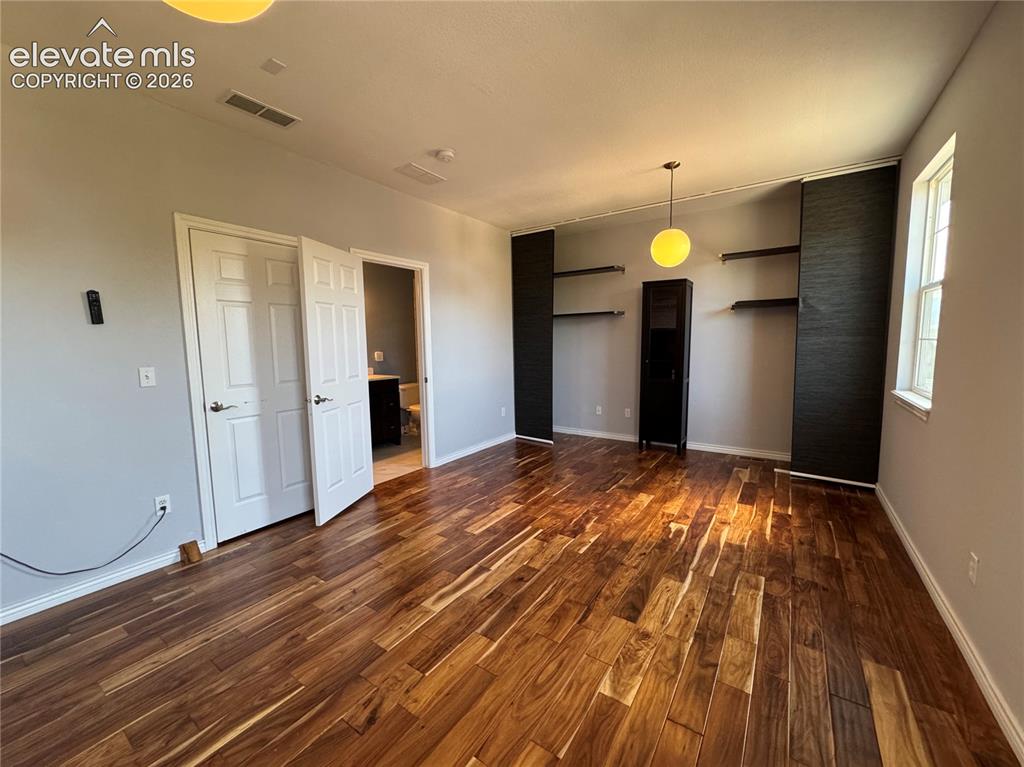 Image 36 of 50: Large bedroom with ensuite bathroom