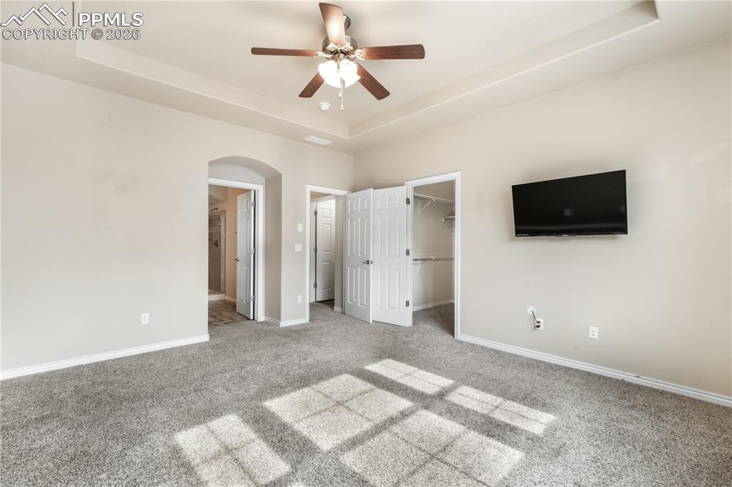Image 38 of 50: 2nd bedroom with large walk in closet and ensuite 5 piece bathroom