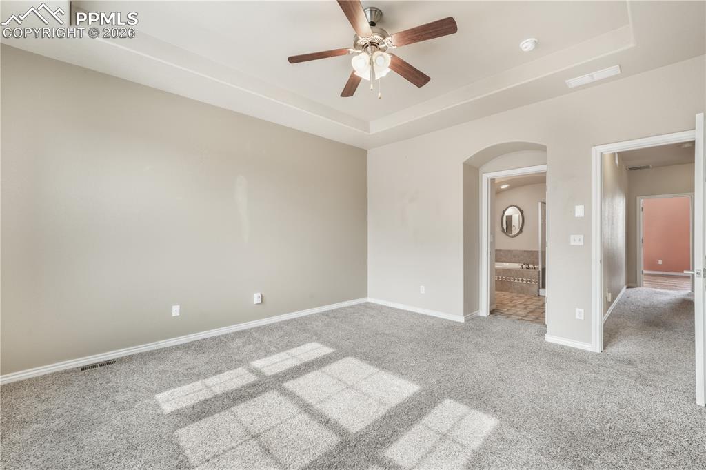Image 39 of 50: 2nd bedroom with large walk in closet and ensuite 5 piece bathroom