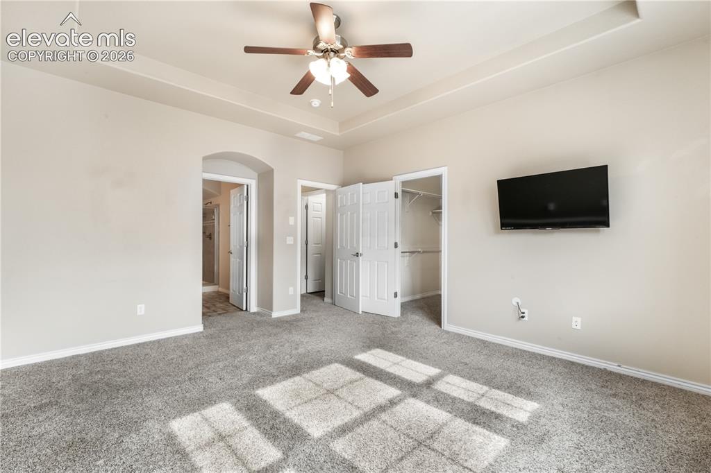 Image 41 of 50: 2nd bedroom with large walk in closet and ensuite 5 piece bathroom