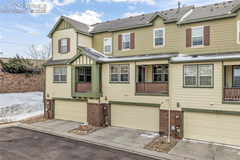 Image 50 of 50: Back of home and 2 car garage