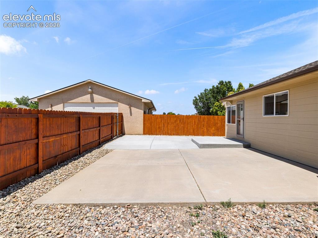 Image 26 of 50: This fenced in yard is for the ADU