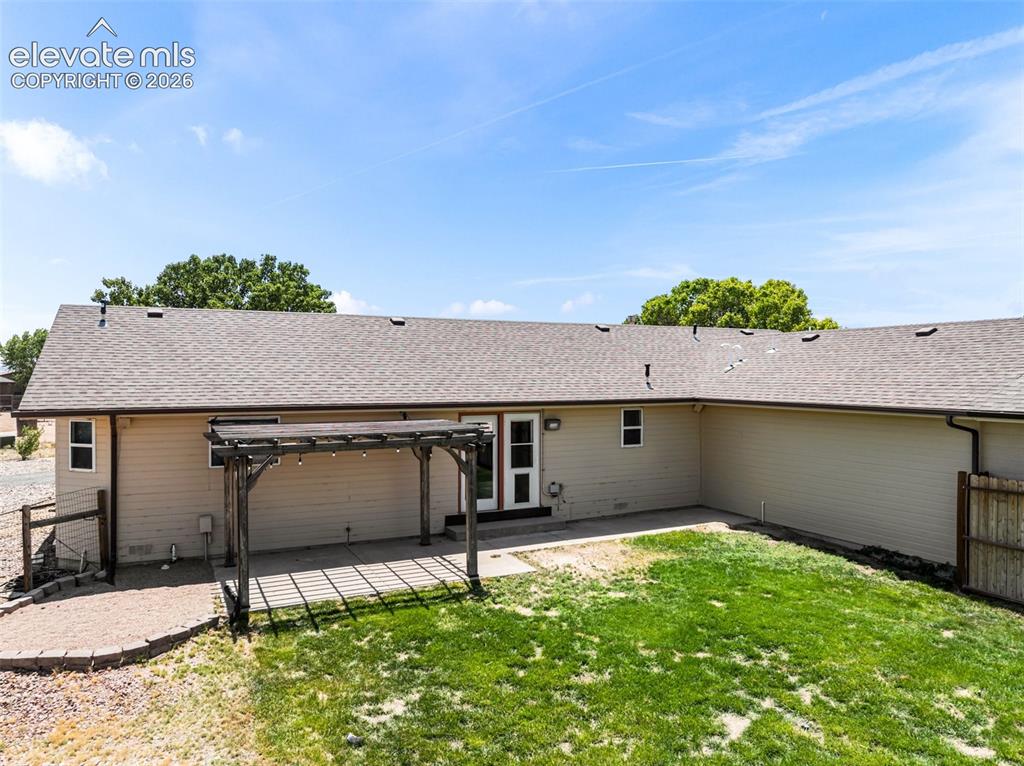 Image 40 of 50: This is the back yard to the main home. Fully fenced and landscaped, drip i