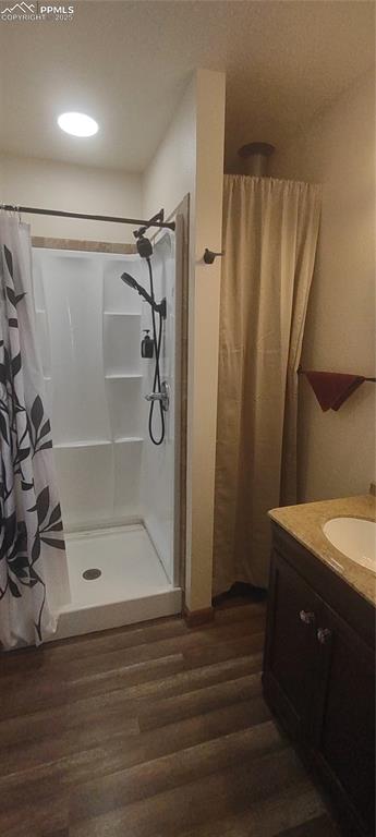 Image 20 of 38: Shower with plenty of shelves and utility area have plumbing on interior wa