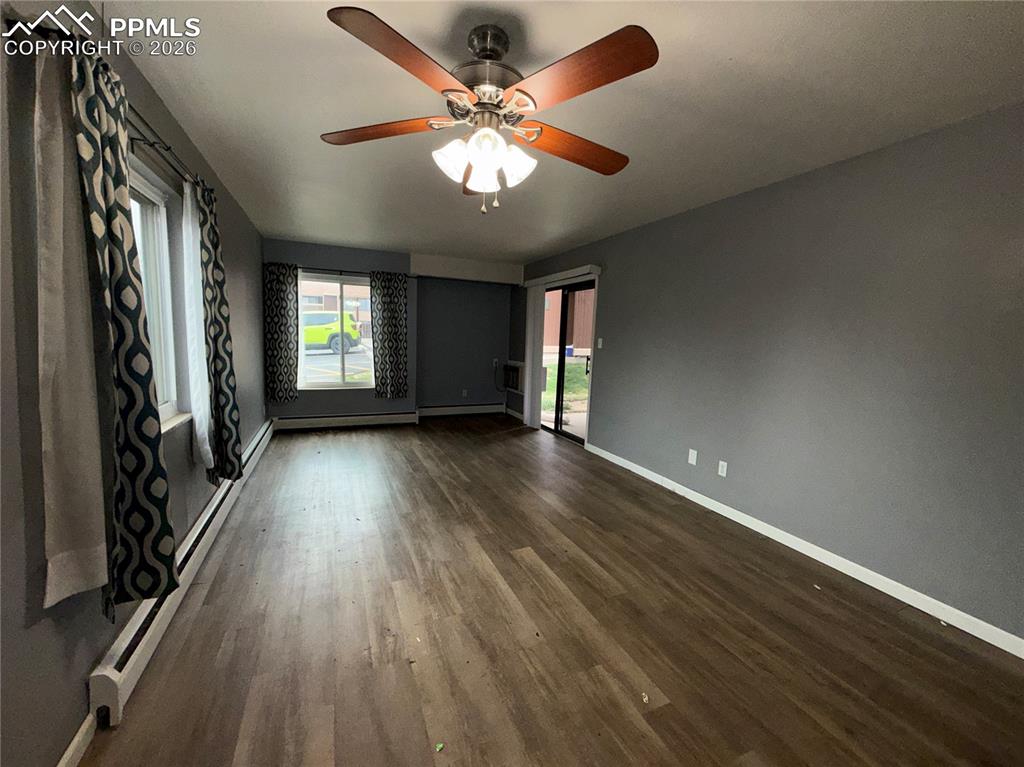 Image 2 of 9: Living room with walk out to patio