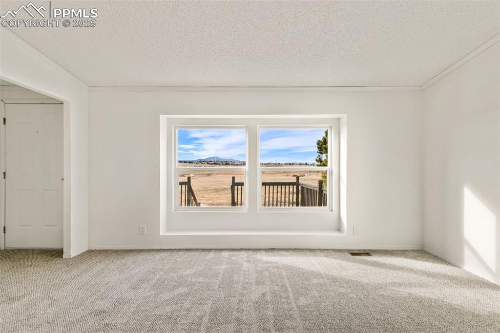 Image 19 of 50: Front picture window in living room