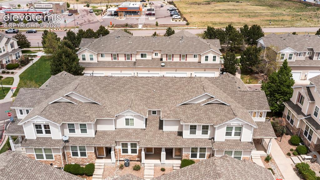 Image 10 of 30: Contemporary townhome development featuring multi-level structures with shi
