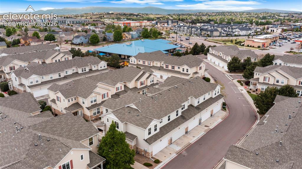 Image 4 of 30: Aerial perspective showcasing a community of multi-story residences with at