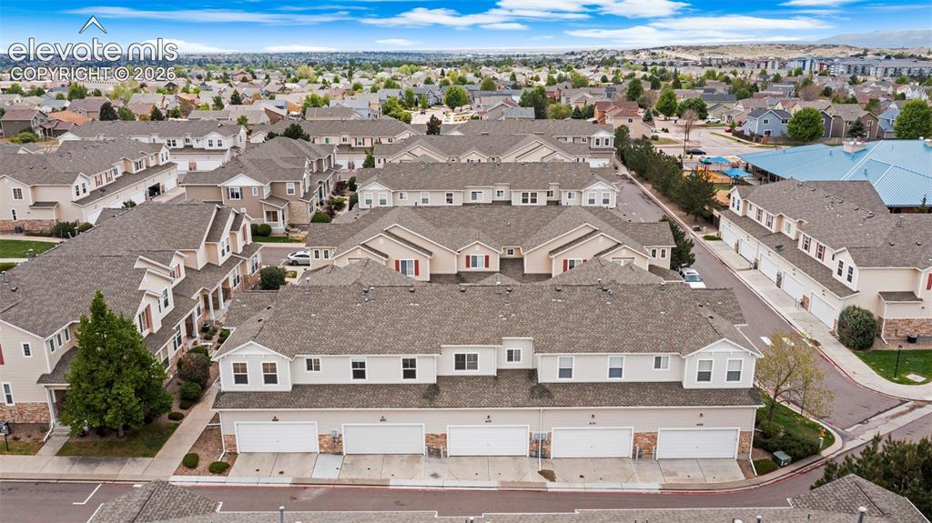 Image 6 of 30: Townhome community featuring multi-level residences with attached garages a