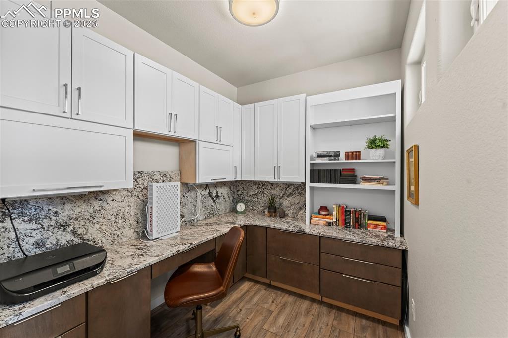 Image 19 of 50: Main level office located at the entrance of the home