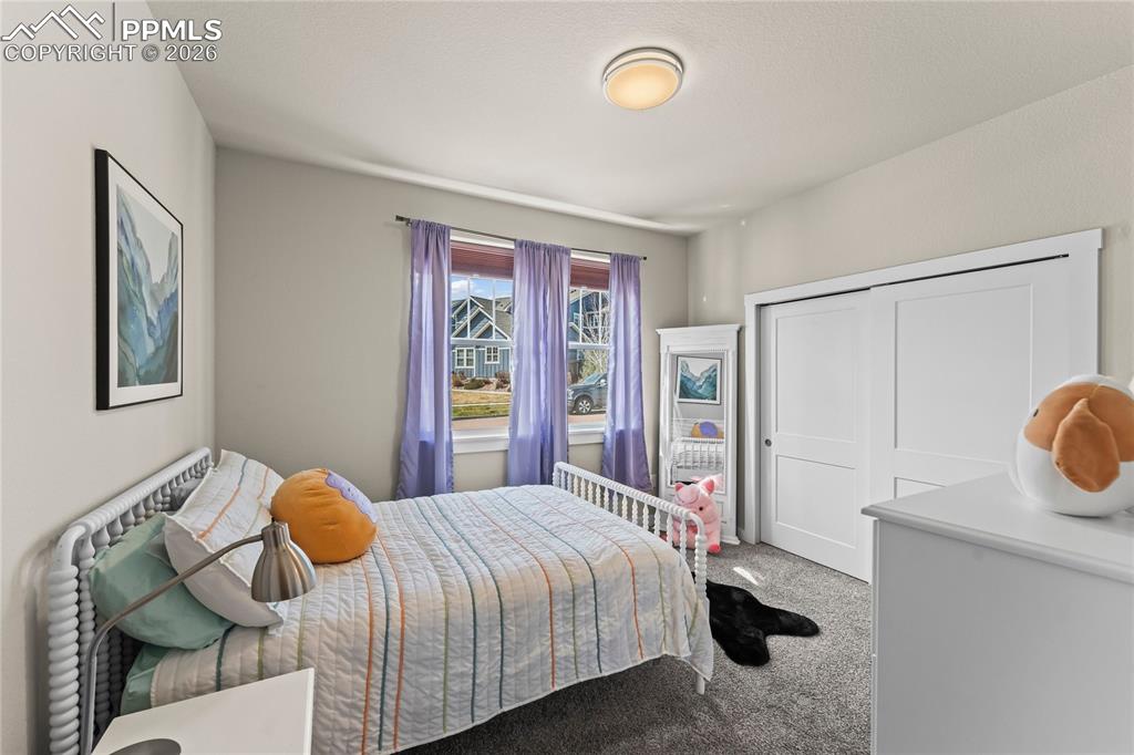 Image 20 of 50: Main level bedroom #2 with attached bath