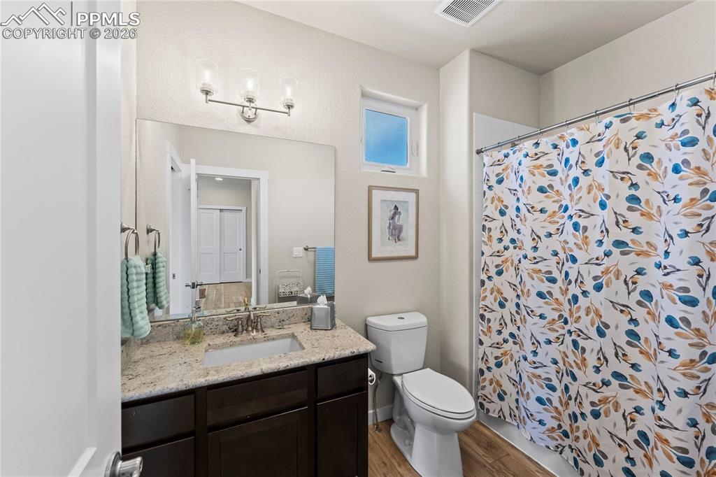 Image 22 of 50: Main level shared bathroom