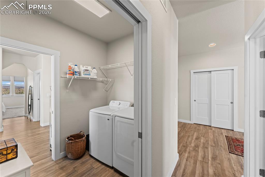 Image 27 of 50: Main level laundry attached to the primary bathroom