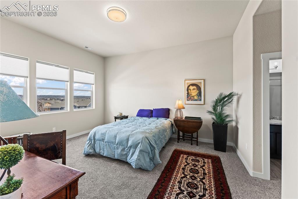 Image 35 of 50: Basement Bedroom #4 with attached bathroom