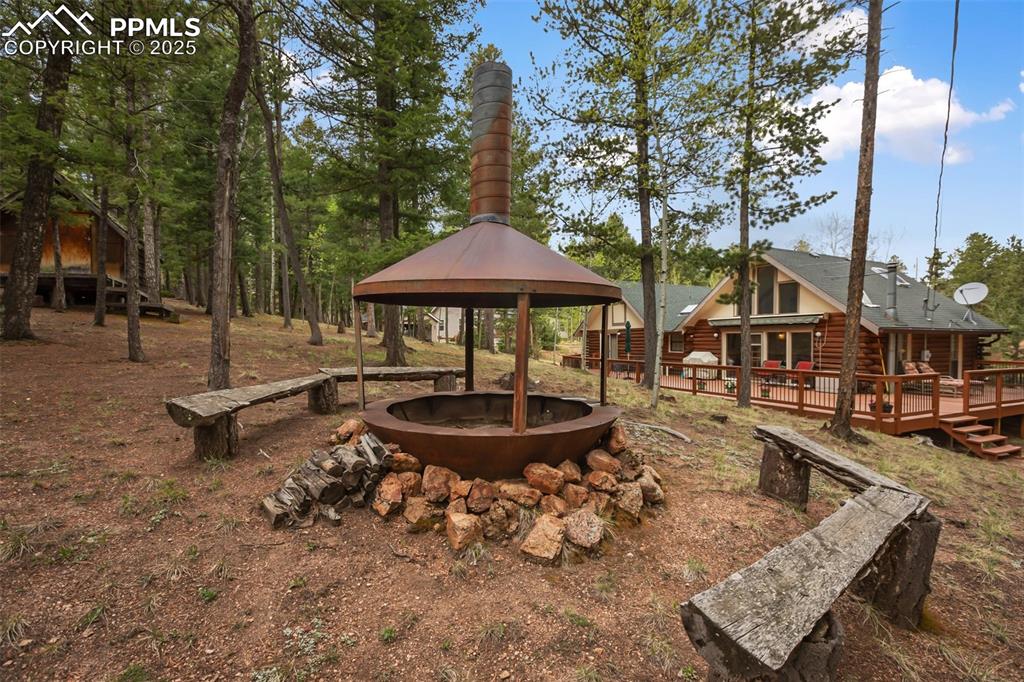 Image 2 of 36: View of yard with a gazebo and a deck