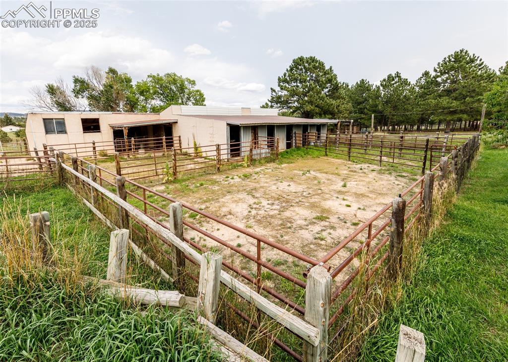 Image 32 of 41: View of barn with an exterior structure, an outbuilding, and a view of rura