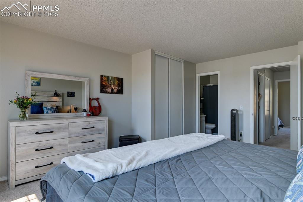 Image 18 of 34: Primary bedroom with adjoining Full Bathroom