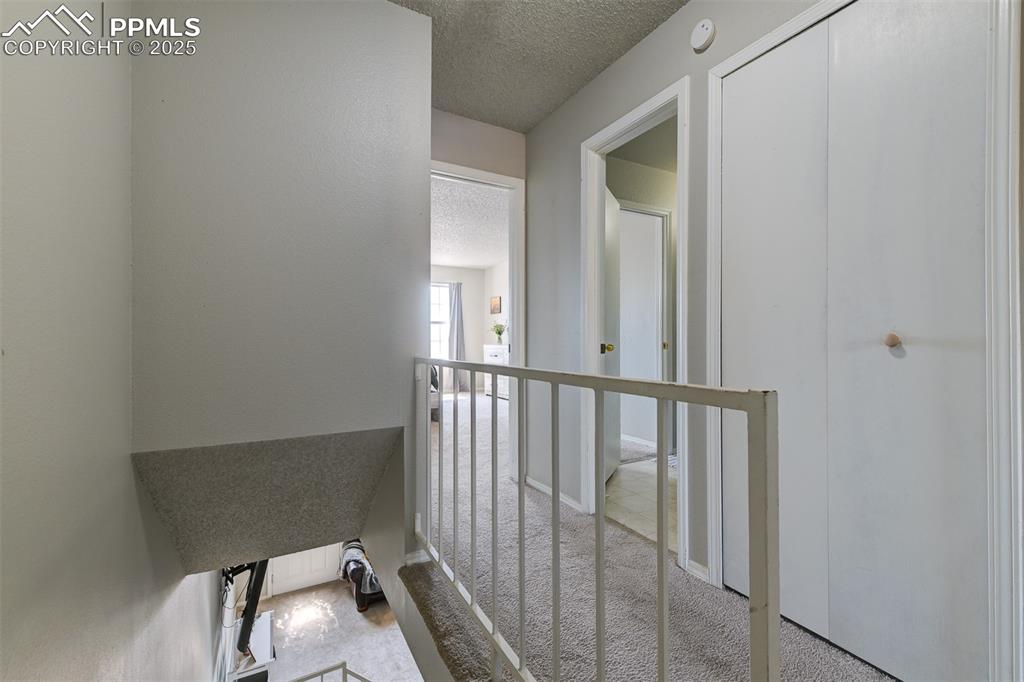 Image 25 of 34: Stairway and Hallway