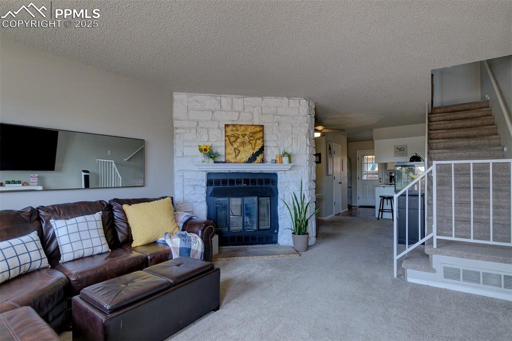 Image 3 of 34: A light and bright living room great you as you enter.