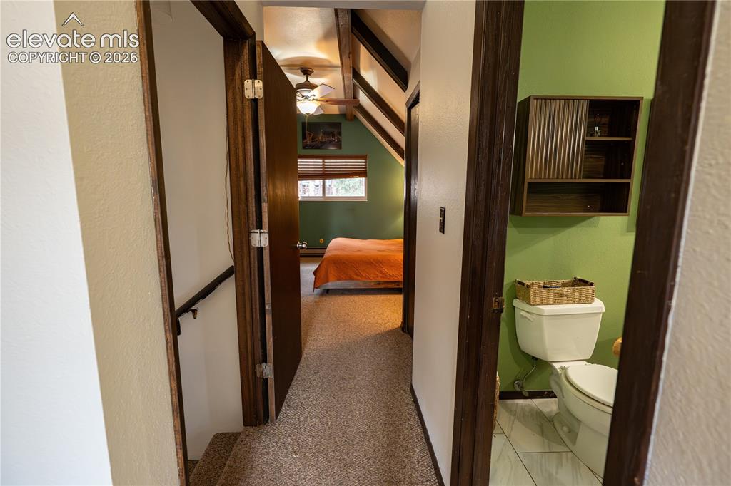 Image 14 of 27: Upper Primary Bed & Bath