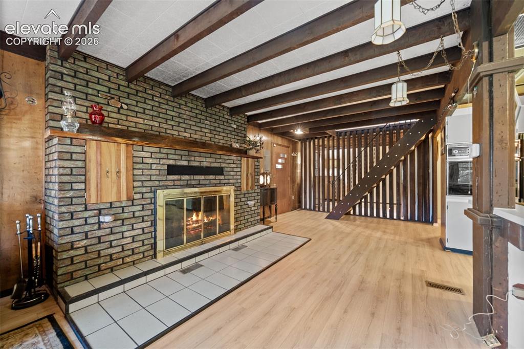 Image 9 of 38: Kitchen with updated appliances, Freshly painted cabinetry and a unique til