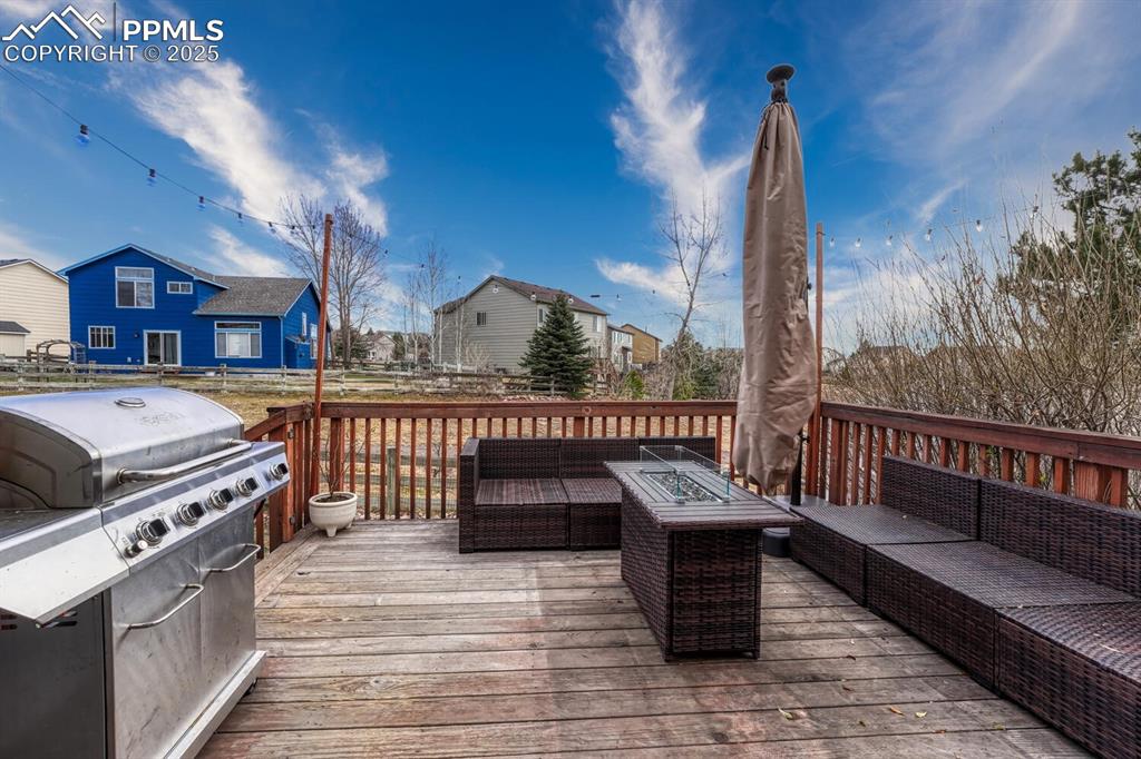 Image 12 of 47: Back deck with mountain views!