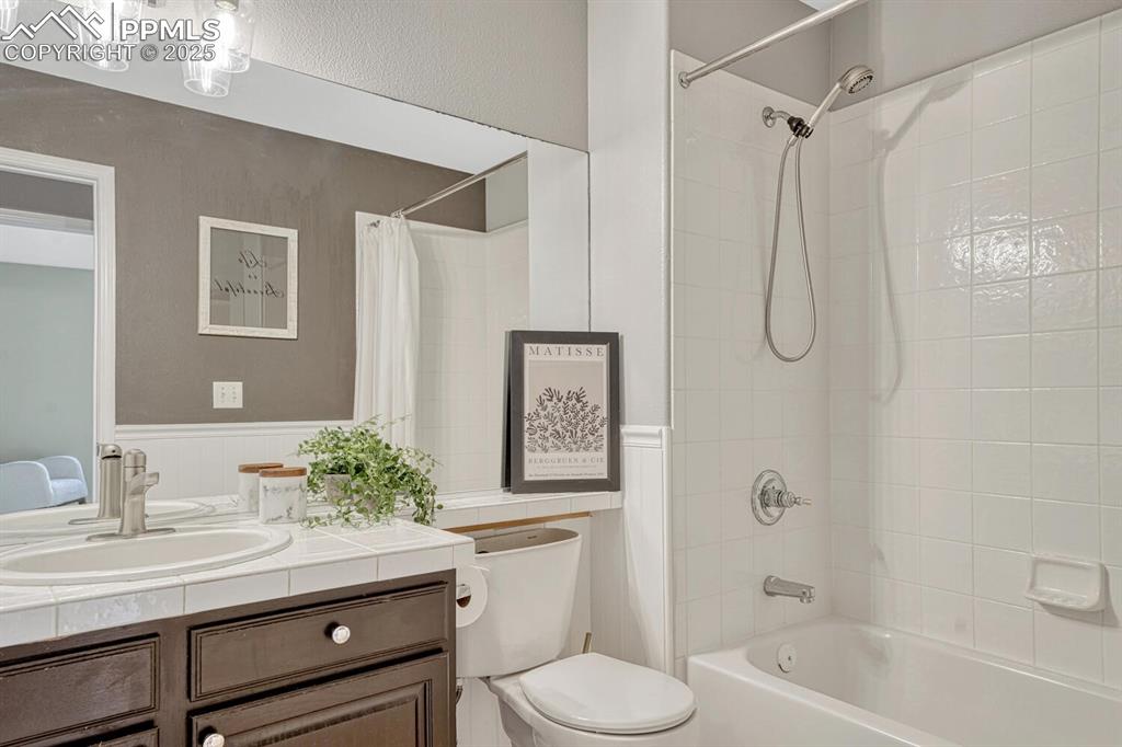 Image 25 of 47: Main level full bathroom.