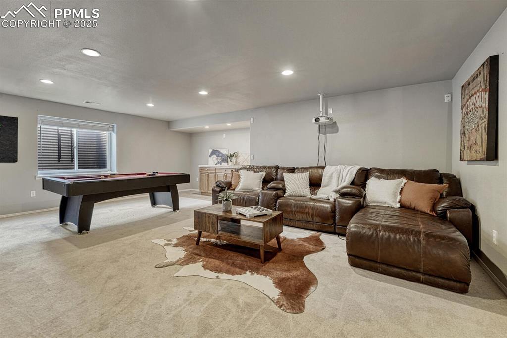 Image 27 of 47: NEW Carpet just installed (not pictured). Large basement family room.