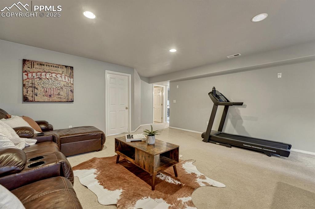 Image 28 of 47: Imagine family movie nights here! NEW Carpet just installed (not pictured).