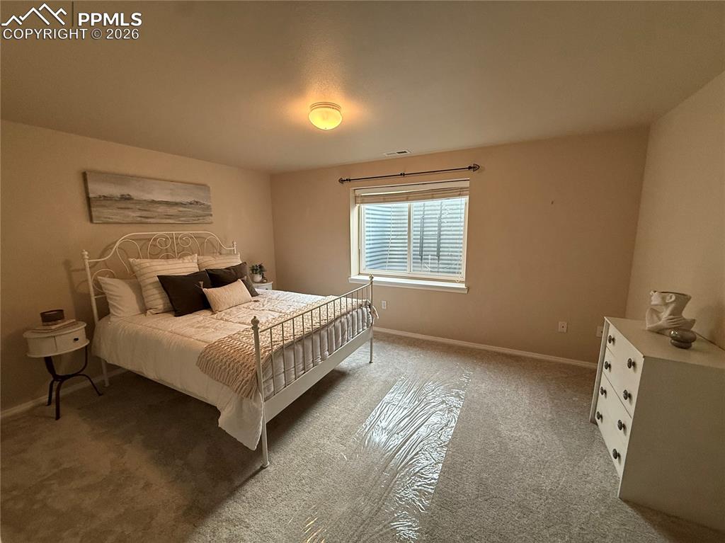 Image 32 of 47: 5th bedroom with ensuite access to the bathroom.