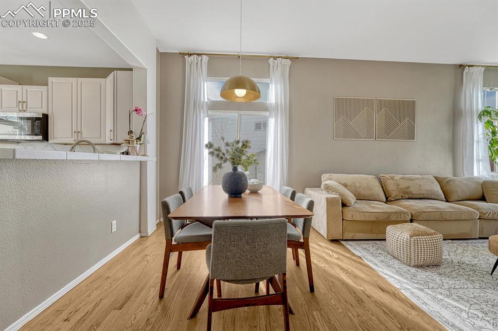 Image 7 of 47: Dining area with upgraded light fixture. 