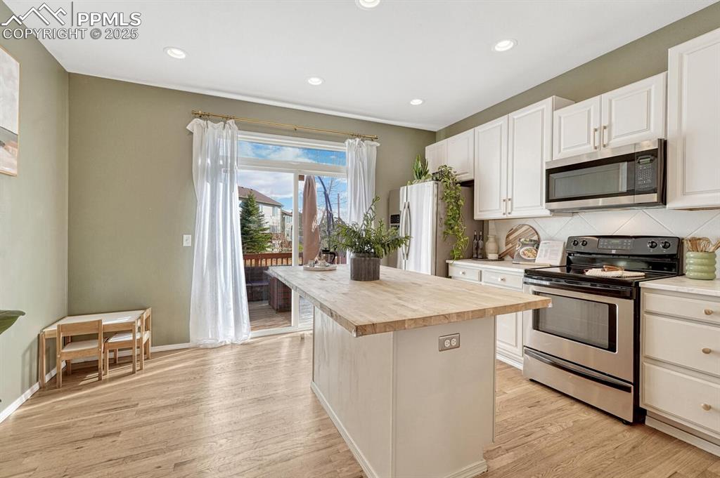 Image 8 of 47: Walkout to the back deck.