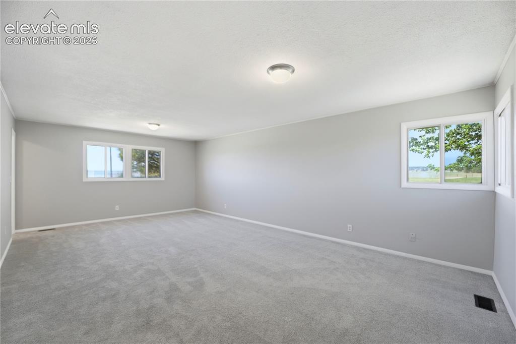Image 17 of 48: Carpet, Dual Closets, Primary Bath, Large Room, Windows All Around