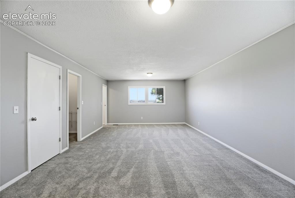 Image 18 of 48: Carpet, Dual Closets, Primary Bath, Large Room, Windows All Around