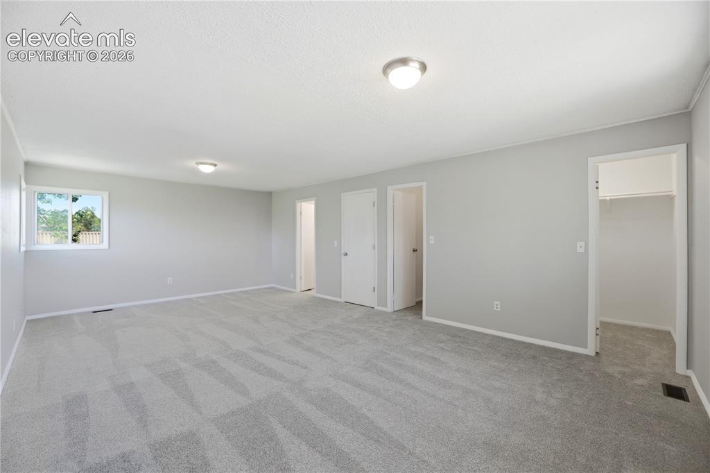 Image 19 of 48: Carpet, Dual Closets, Primary Bath, Large Room, Windows All Around