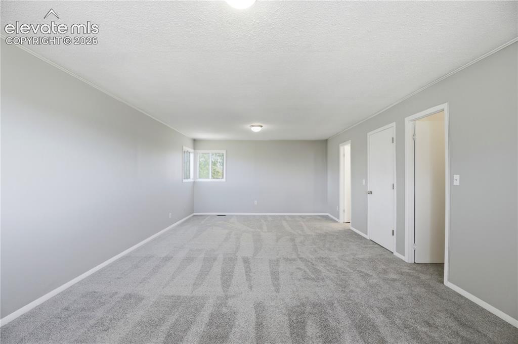 Image 20 of 48: Carpet, Dual Closets, Primary Bath, Large Room, Windows All Around