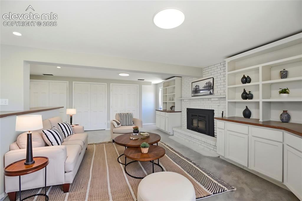 Image 22 of 48: Carpet, Closets, Built Ins, Fireplace, Dry Bar
