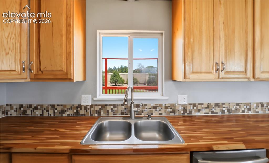 Image 9 of 48: Butcher Block, Open Concept, Vinyl Plank, Mud Space Through Kitchen, Dining