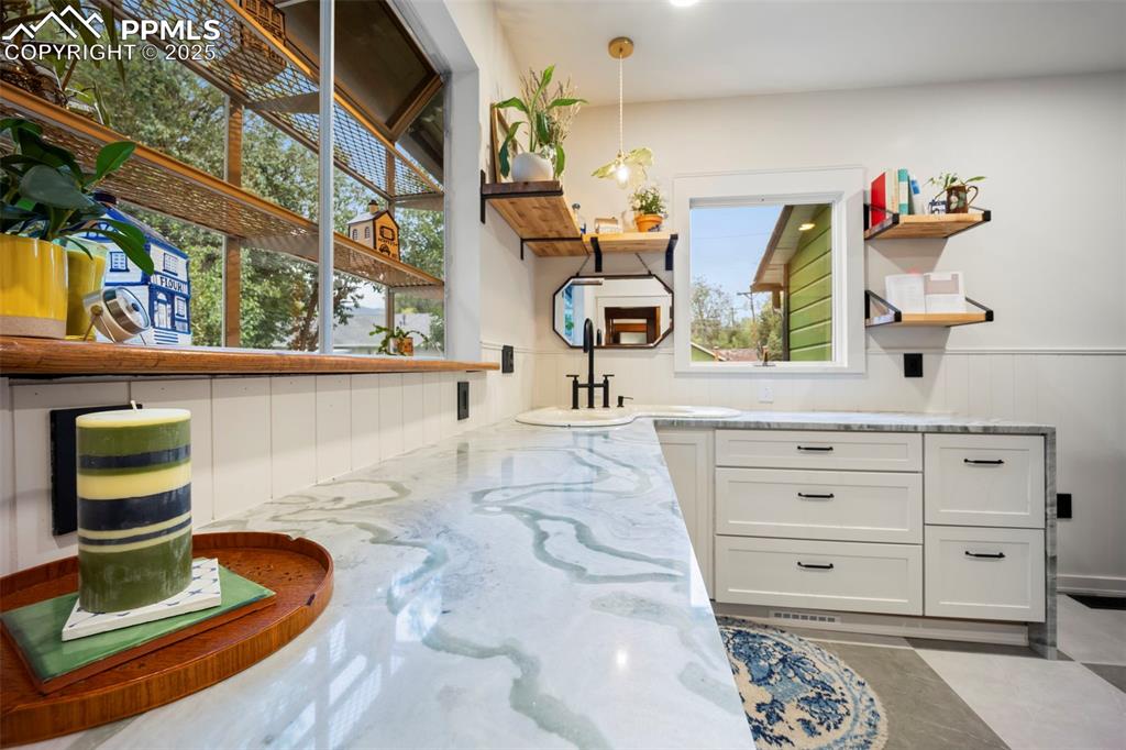 Image 12 of 48: Detailed view of wainscoting and a sink