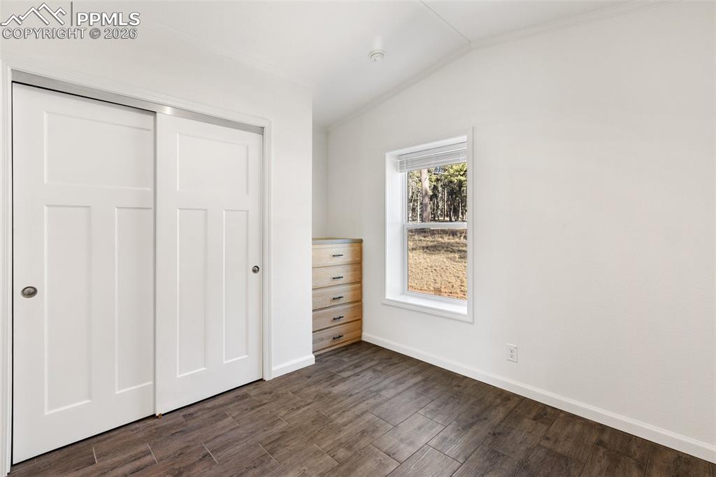 Image 13 of 19: Bedroom with closet and built in.