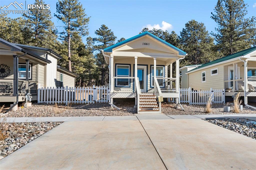Image 2 of 19: Front of home and parking.