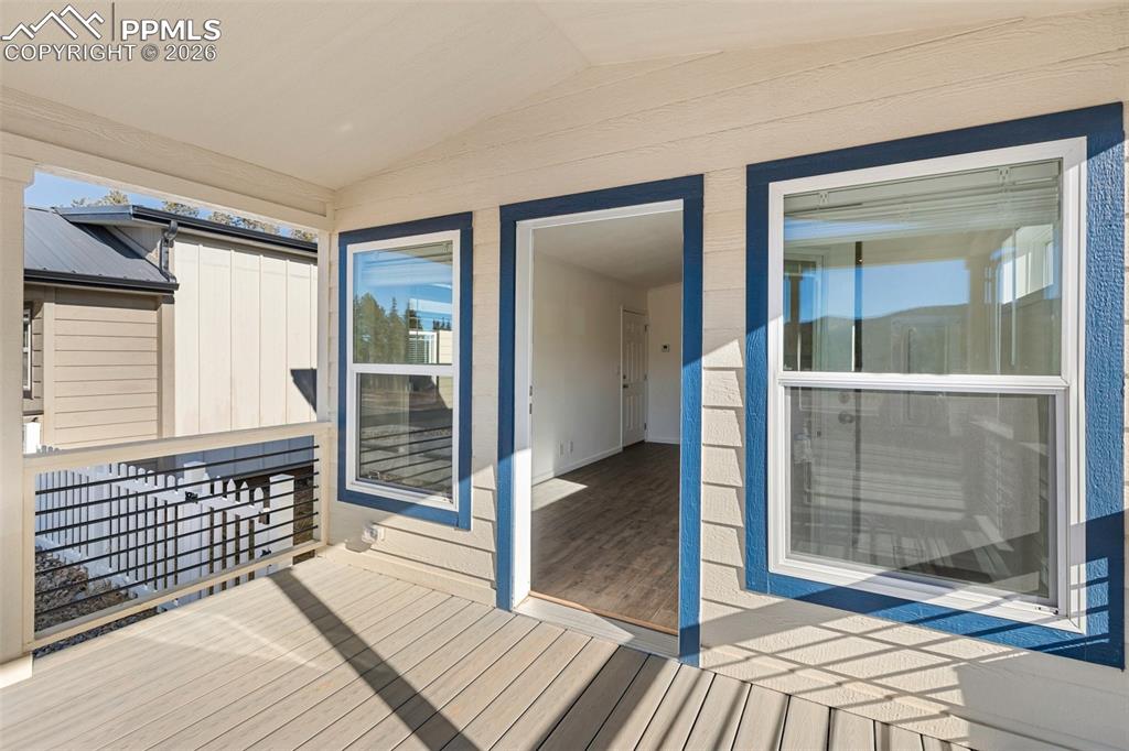 Image 3 of 19: Deck and front door.