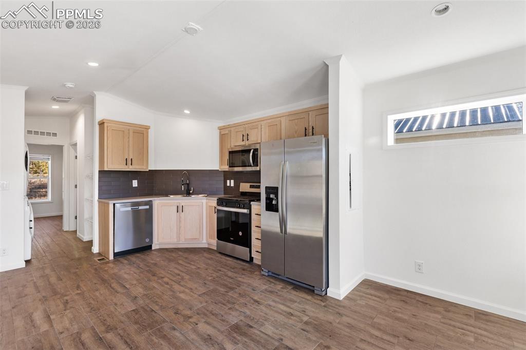 Image 5 of 19: Kitchen and living room.