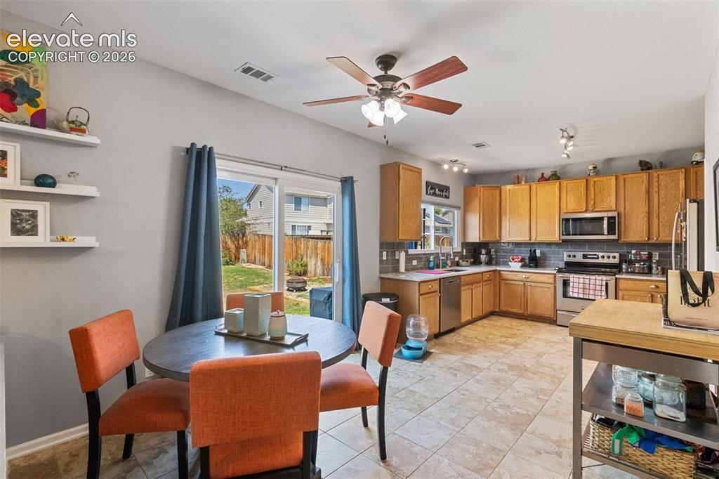 Image 12 of 39: Kitchen & dining area.