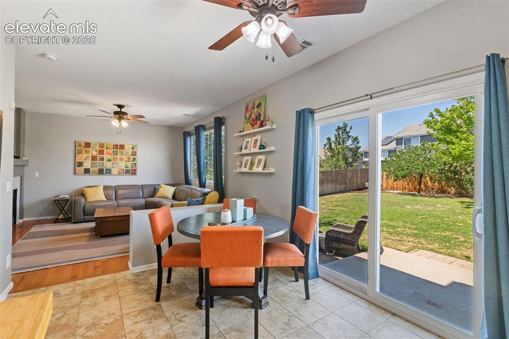 Image 13 of 39: Dining area & large walkout door.