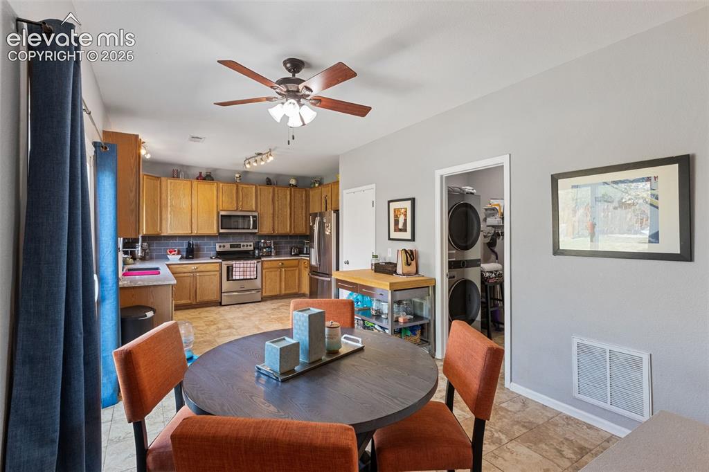 Image 14 of 39: Dining area, laundry & kitchen.