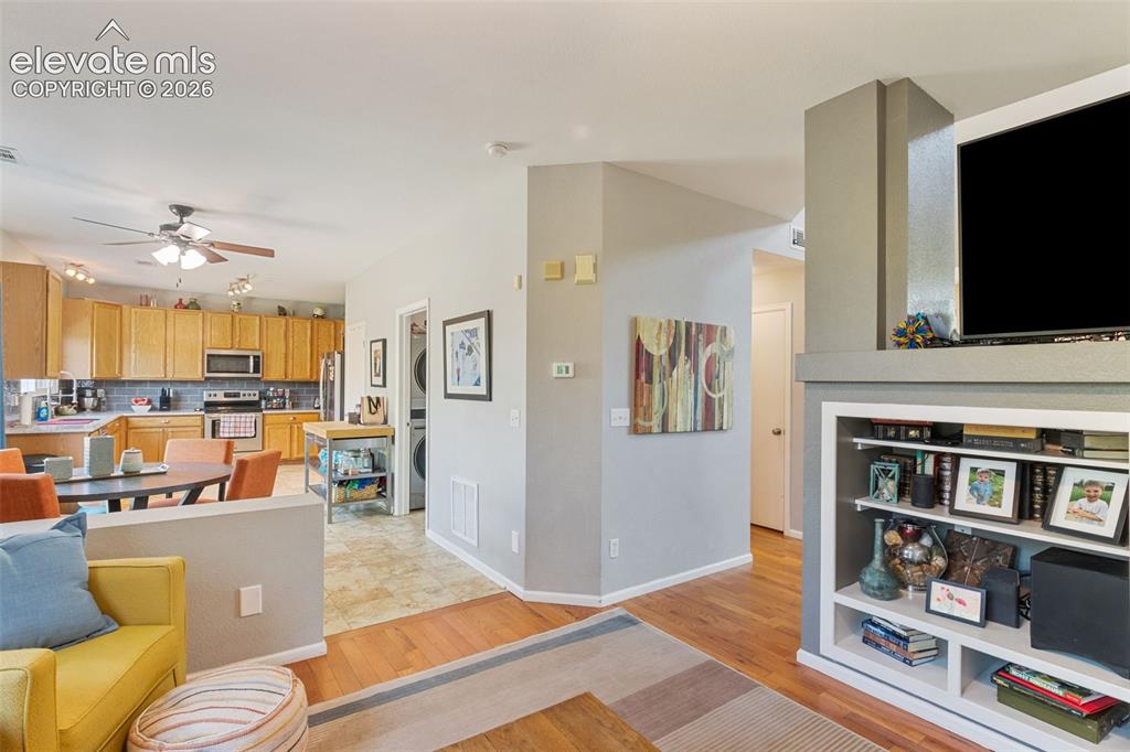 Image 18 of 39: Family room looking towards kitchen & laundry.