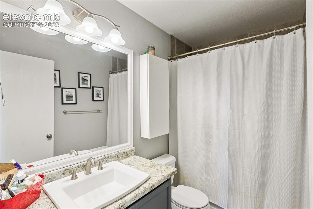 Image 32 of 39: Upper full bath.