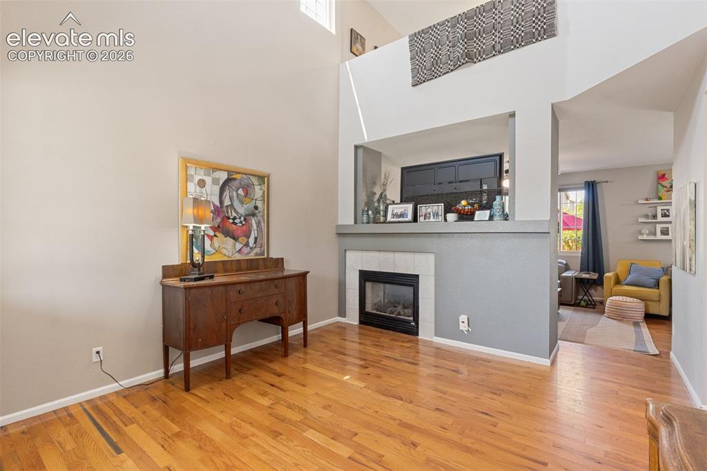 Image 5 of 39: Living room with fireplace.