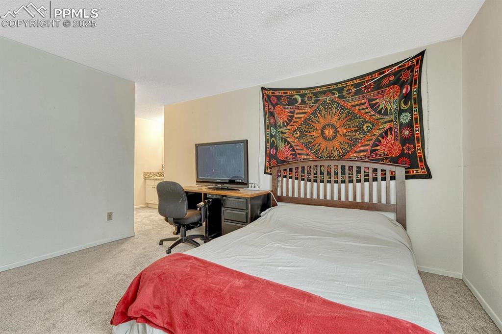 Image 10 of 48: Primary bedroom on main with ensuite